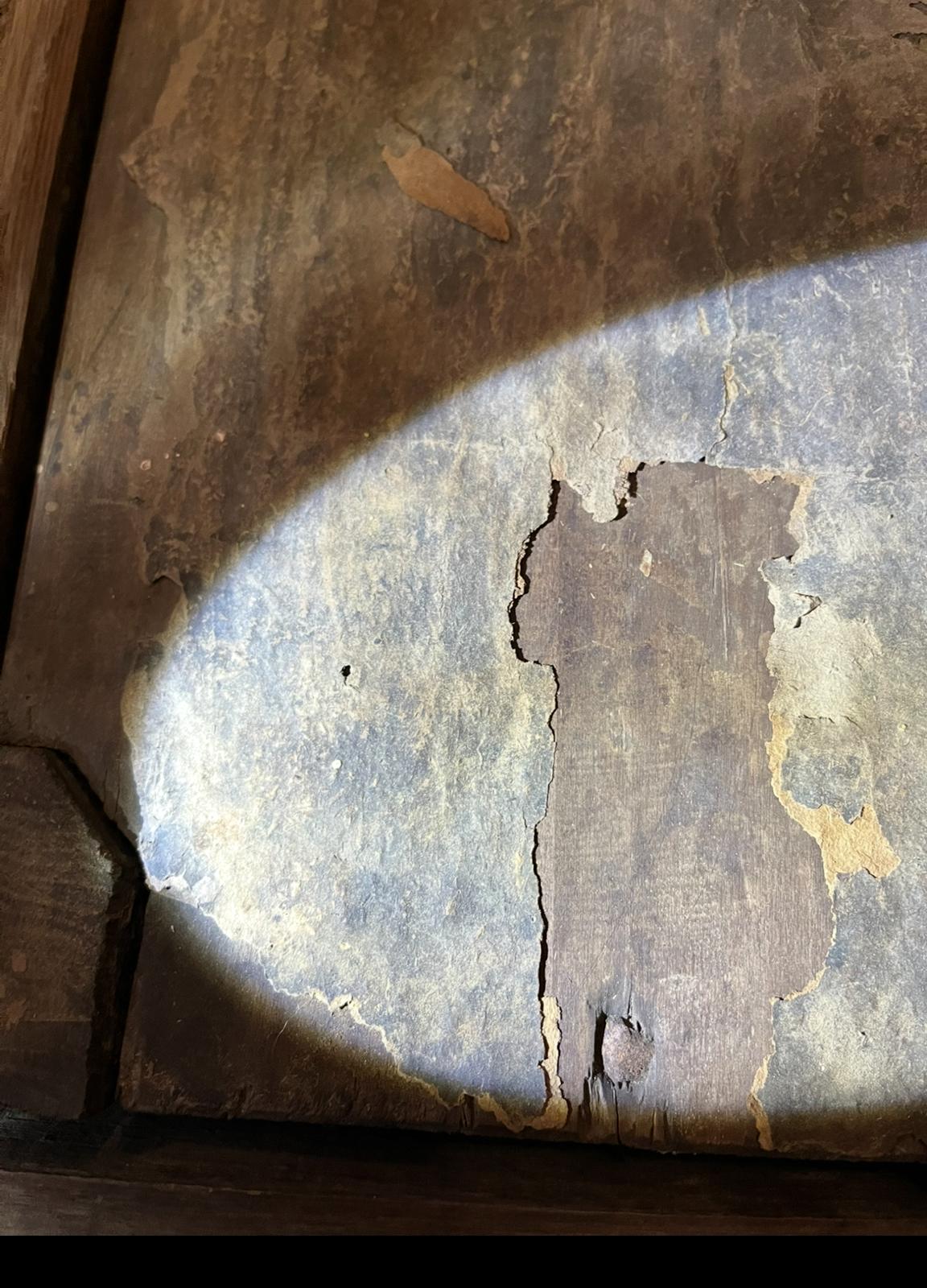 Another tear straight through the old layer, which is crumbling into fragments