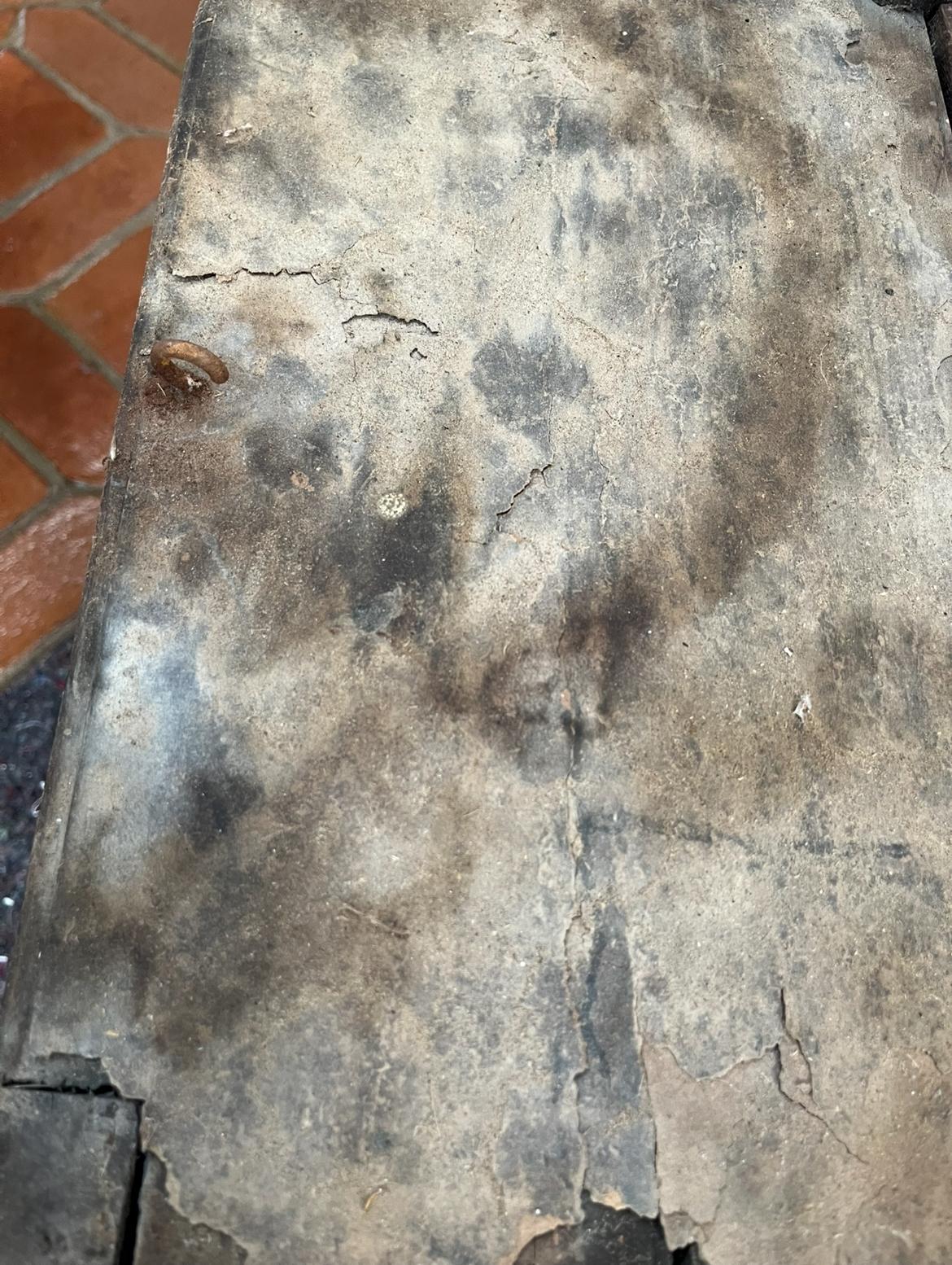Another corner of the roof with a small forged fitting embedded in the cracked layer
