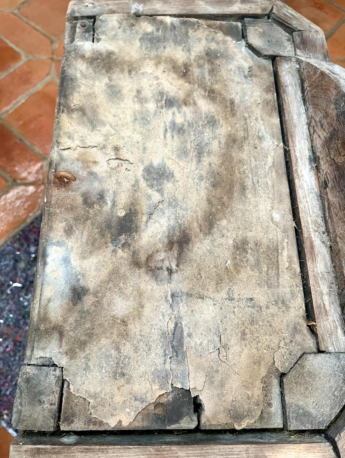 The hood's roof near its carved octagonal trim