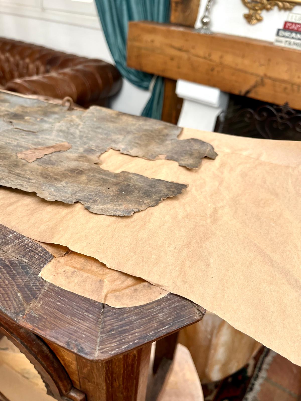 The kraft paper after soaking and drying under a press — a stable, flat canvas