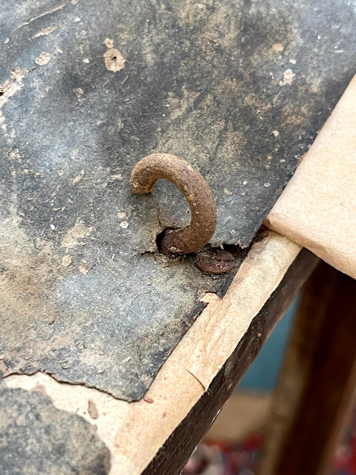 A macro shot of the century-old forged hook itself