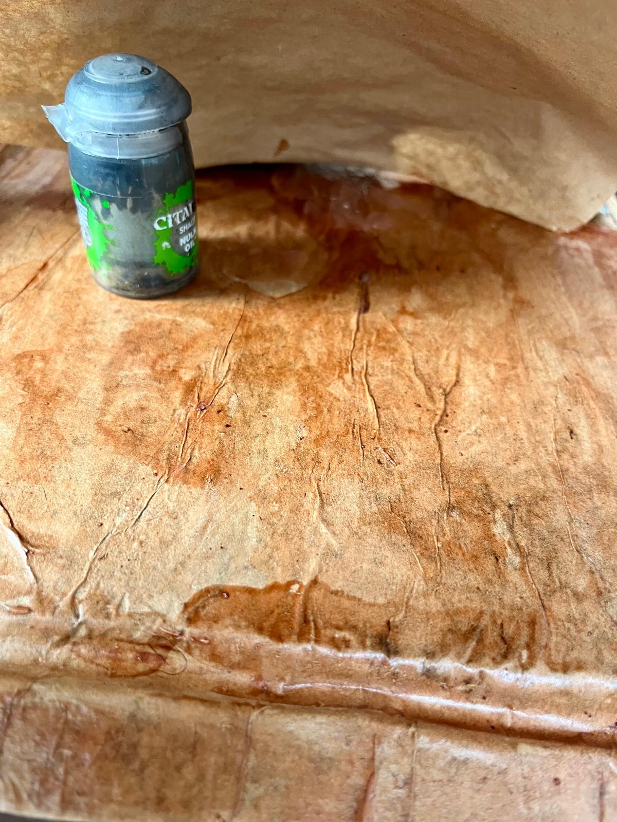 The glued kraft paper, showing the amber tint of the Lakeone Caoba stain
