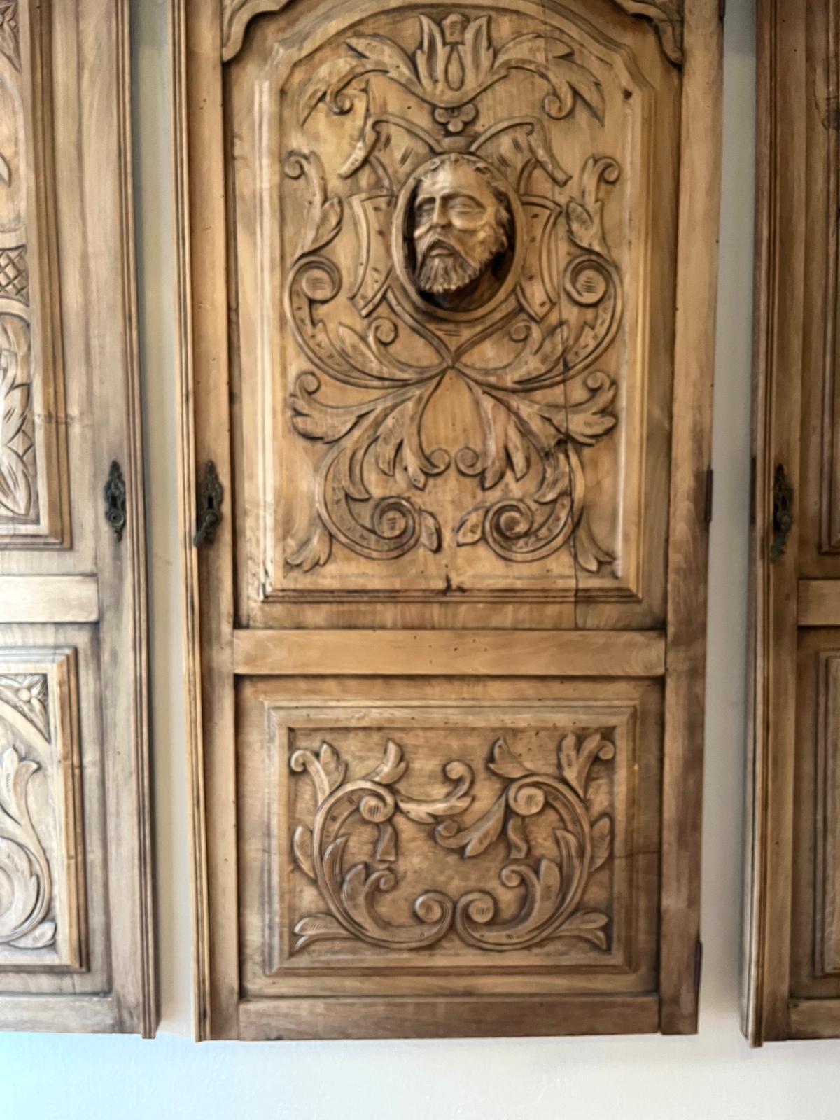 Close-up of the central mascaron with a bearded man's head in a medallion, surrounded by acanthus scrolls