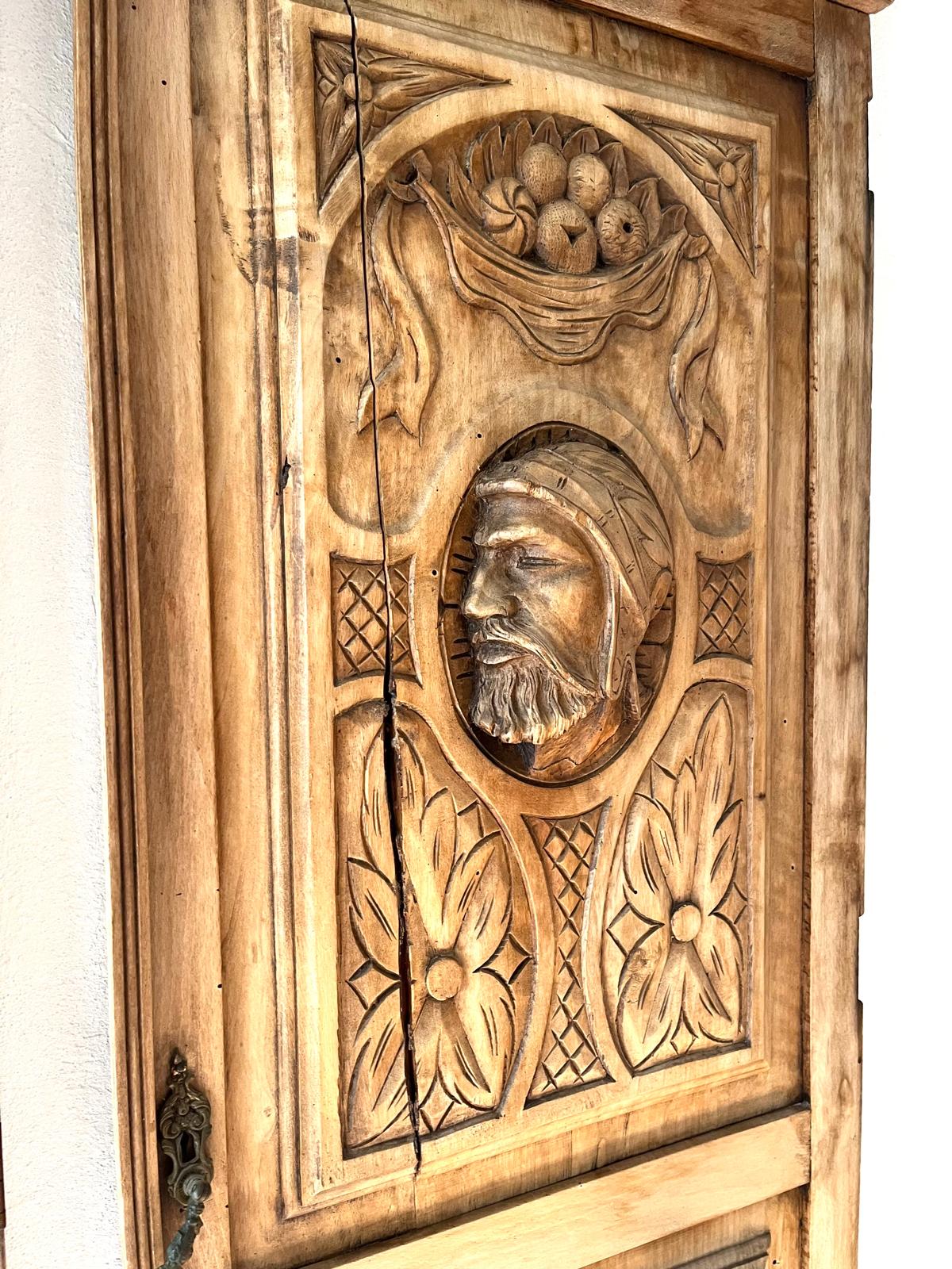 Detail of the right panel with the radial crack running through the hooded man's profile