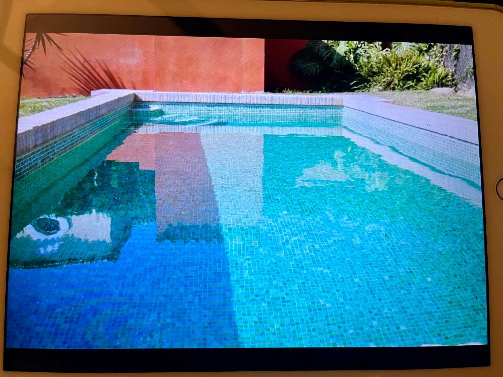The pool, hidden from outside eyes, by the house's terracotta wall